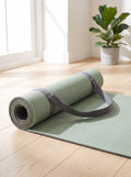 Sage Grip 6 mm TPE Yoga Mat half unrolled with its graphite carry strap